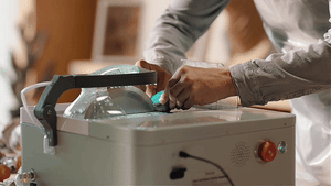 Man uses ToAuto gemstone smart cutter to cut stone with clean perfect cutting effect for jewelry making